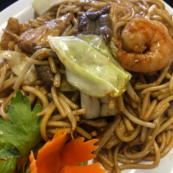 Mei Hon Chinese Restaurant's lo mein with shrimp, beef, chicken, cabbage, and decorative carrot.